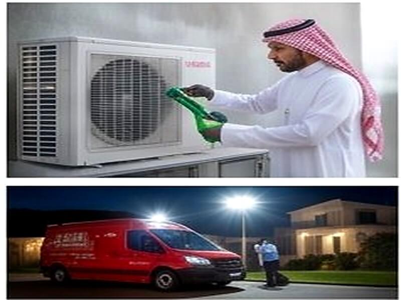 فريق تركيب يعمل على الوحدة الخارجية للمكيف